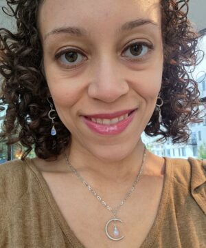 Minimalist moonstone jewelry set worn indoors