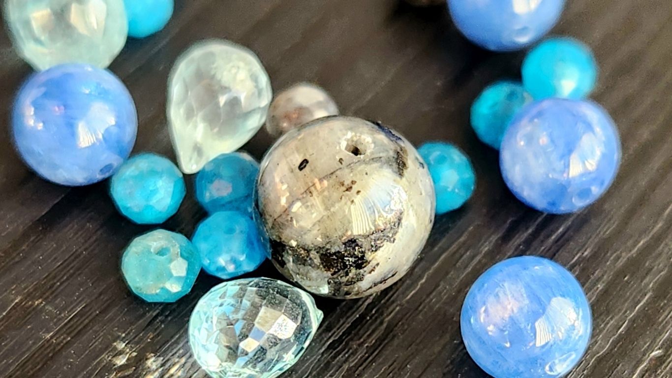 Sea inspired silver jewelry materials featuring aquamarine, kyanite, blue labradorite, and blue apatite