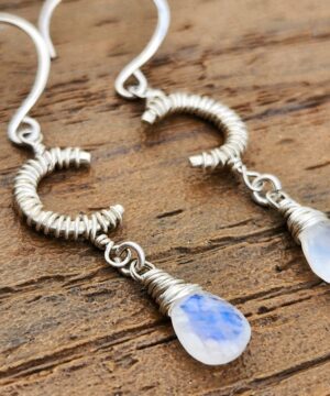 Sterling silver handmade moonstone jewelry on brown table