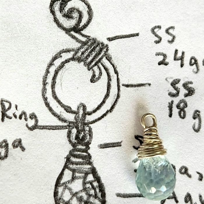 Sterling silver ocean jewelry design sketch featuring wire-wrapped aquamarine gemstone