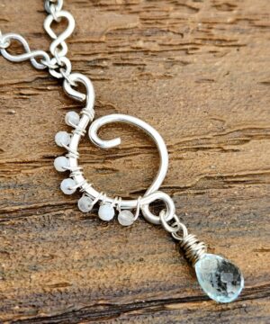 Aquamarine sterling silver pendant with wire-wrapped rainbow moonstones