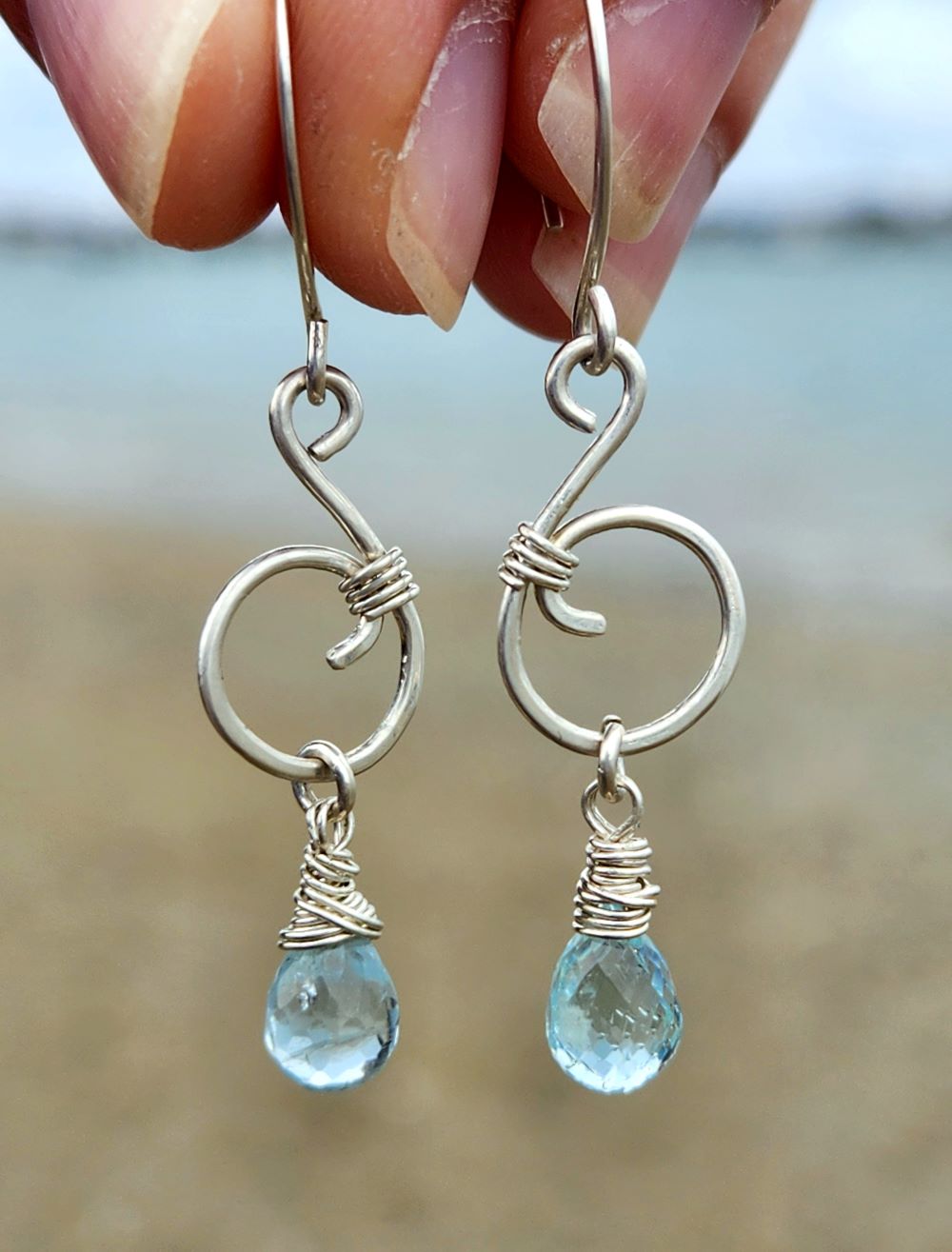 Aquamarine sterling silver wave earrings inspired by the ocean at the beach