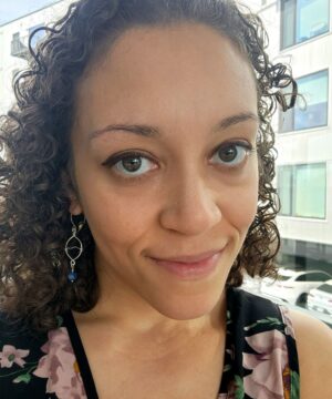 Wearing ocean-inspired kyanite earrings indoors made with solid sterling silver