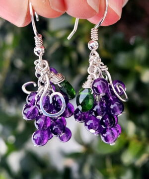Holding sterling silver chrome diopside amethyst cluster earrings inspired by nature