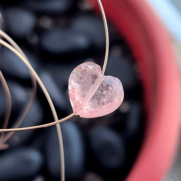 Love-inspired jewelry featuring heart-shaped gemstones like strawberry quartz