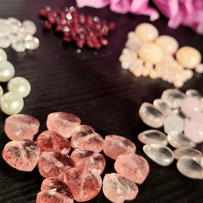 Meaningful heart jewelry gemstones with garnet, rose quartz, strawberry quartz, morganite, pearls, and pink opals
